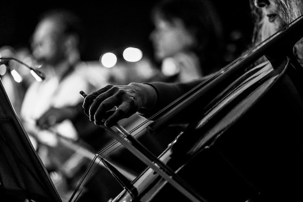 Photo midsection of woman playing cello