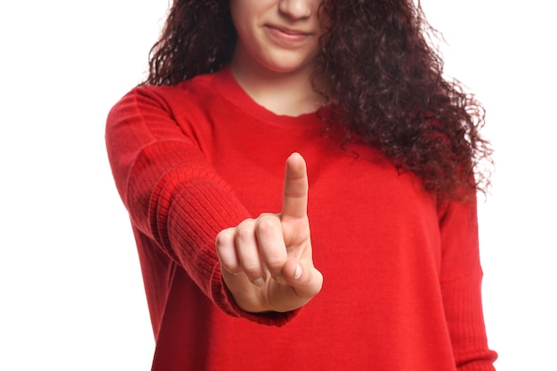 Photo midsection of woman pointing against white wall