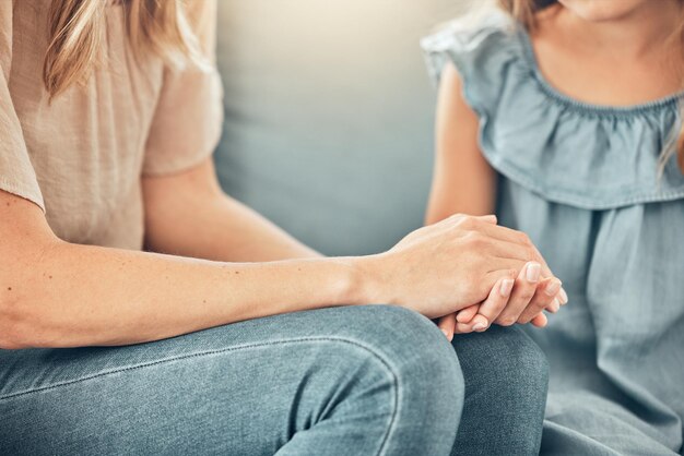 Midsection of woman sitting at home