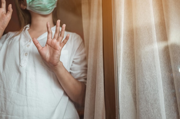 Photo midsection of woman standing by curtain