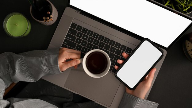 Midsection of woman using laptop