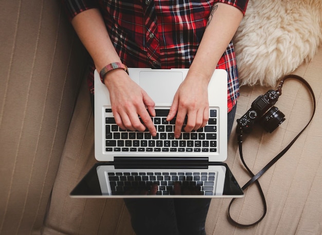 midsection of woman using laptop