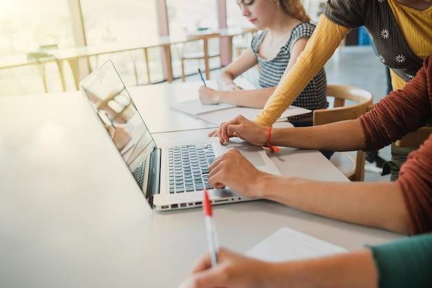 Midsection of woman using laptop