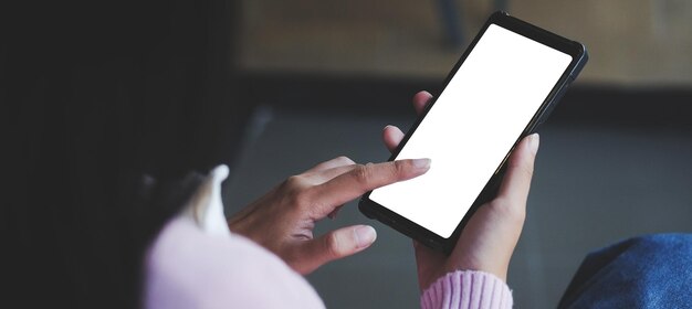 Midsection of woman using mobile phone