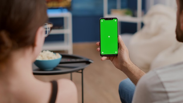 midsection of woman using mobile phone