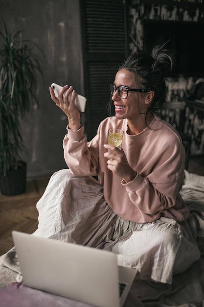 Midsection of woman using mobile phone