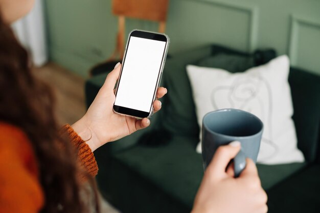 Midsection of woman using mobile phone