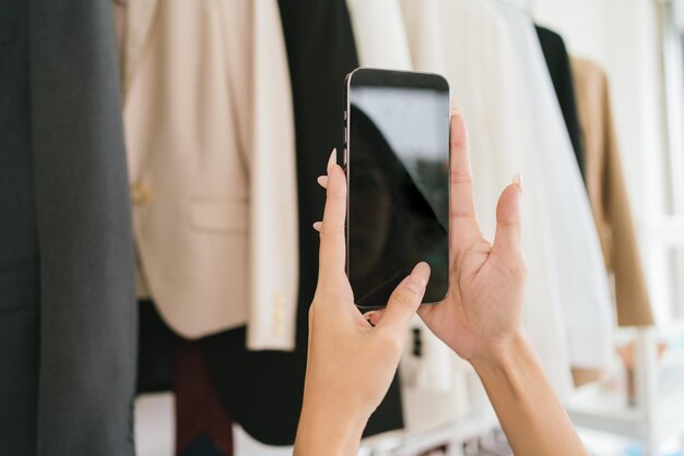 Midsection of woman using mobile phone