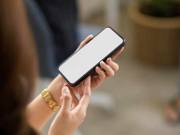 Midsection of woman using mobile phone