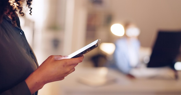 Midsection of woman using mobile phone