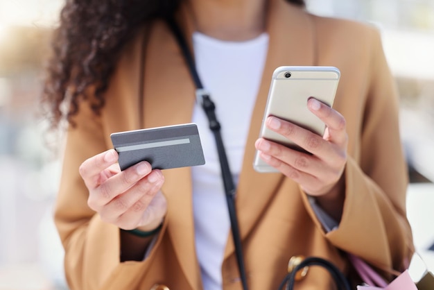 midsection of woman using mobile phone
