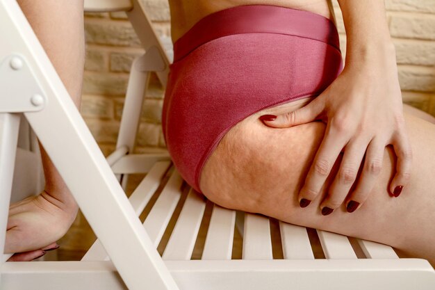 Photo midsection of woman wearing lingerie sitting on chair