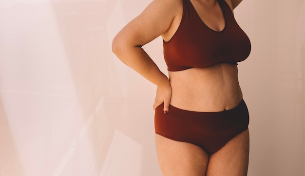 Midsection of woman wearing lingerie