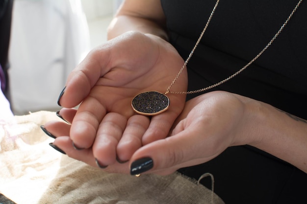 Midsection of woman wearing necklace