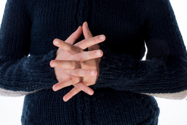 Photo midsection of woman wearing warm clothing standing against white background