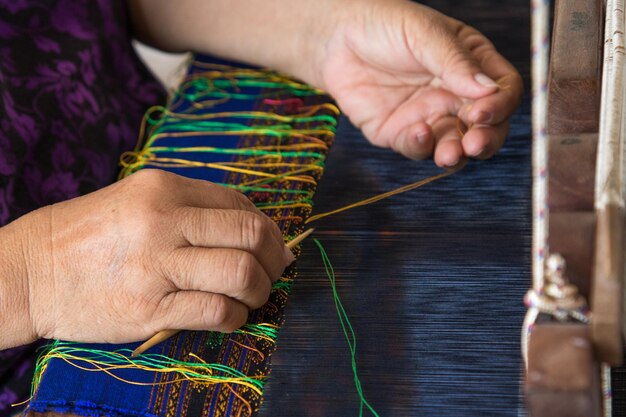 Photo midsection of woman weaving