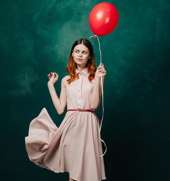 Midsection of woman with balloons