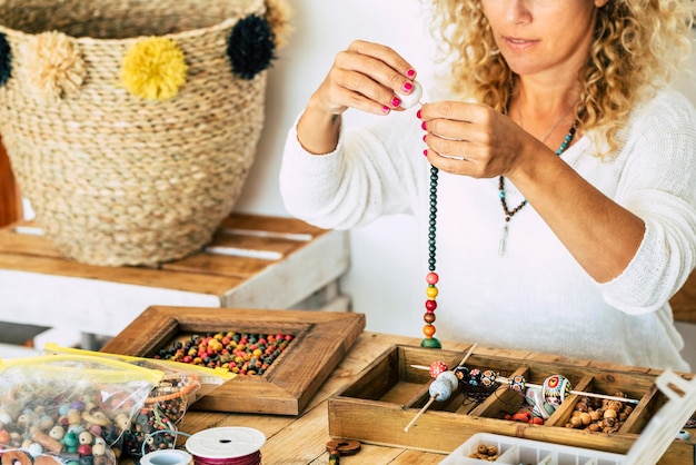 Midsection of woman with bead necklace