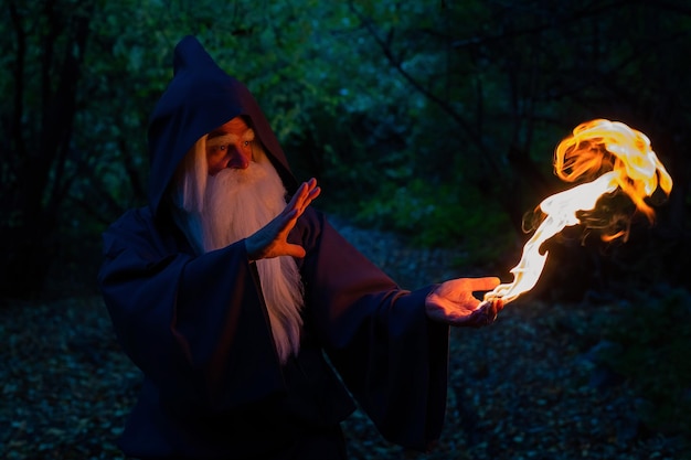 Photo midsection of woman with fire crackers in forest