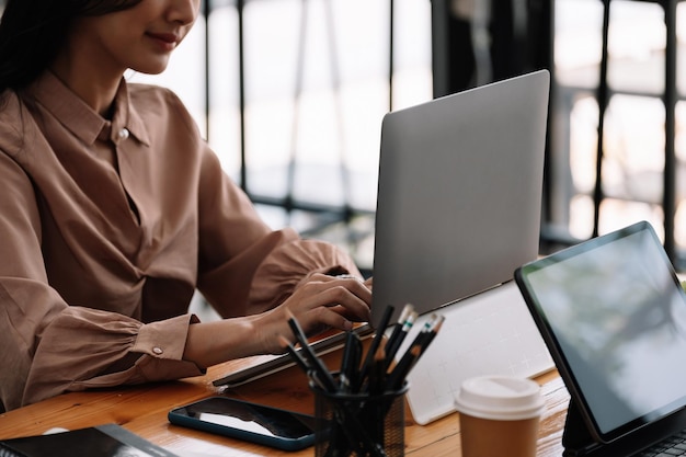 Midsection of woman working on table