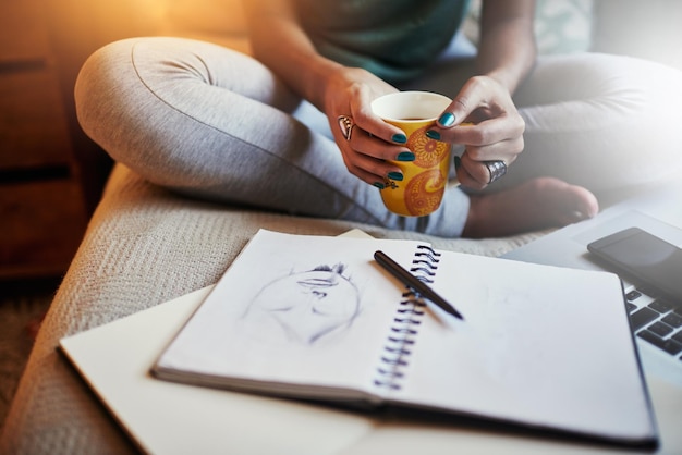 Photo midsection of woman writing on book