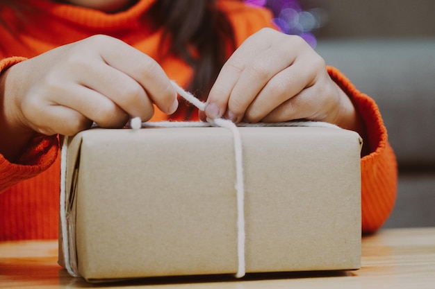 Photo midsection of woman writing in box