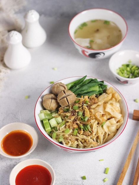 Mie ayam (noodles with chicken, meatballs, dumplings and vegetables), popular street food