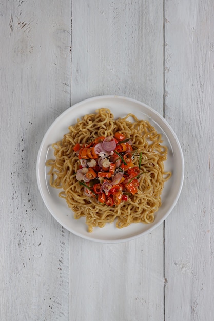 Mie goreng sambal matah or Instan fried noodle served with sambal matah