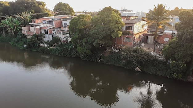 Mighty Paraiba do Sul river in Volta Redonda Rio de Janeiro Brazil houses on the banks of the polluted river