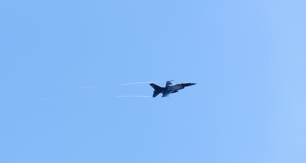 Military aircraft flying over blue sky