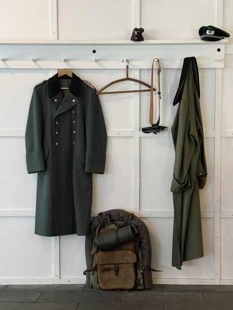 Photo military clothes on the white wall