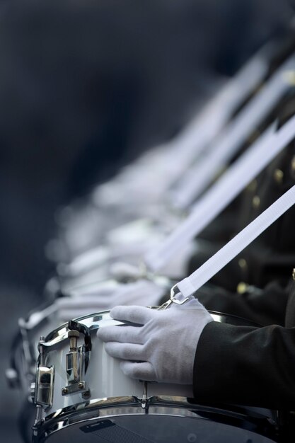 Military drummers play drums. Close-up selective focus.