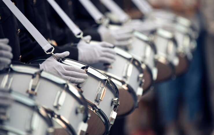 Military drummers play drums. Close-up selective focus.