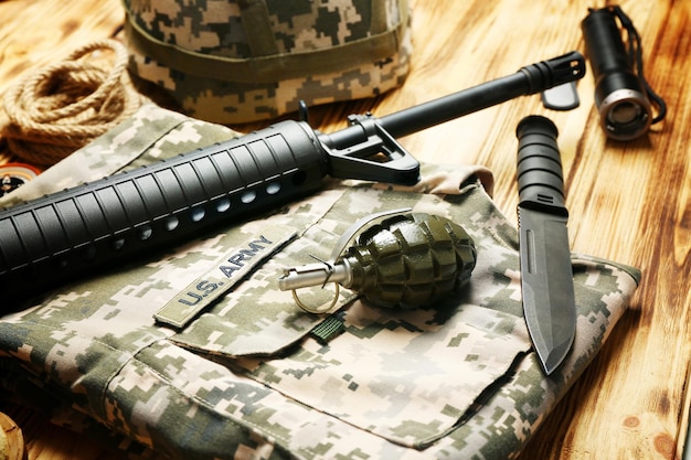 Military equipment on wooden background