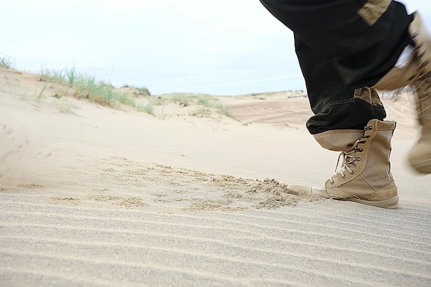 military exercises in the desert / legs in army boots, soldiers of the desert