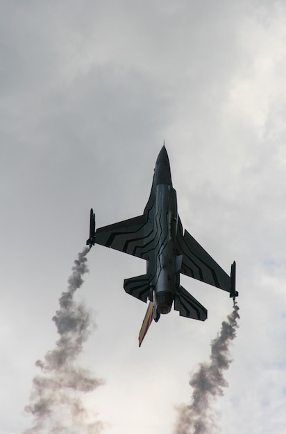 A military fighter plane in the sky at an air show in Greece