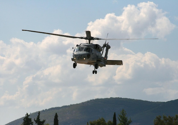 Military helicopter in the sky at an air show in Greece