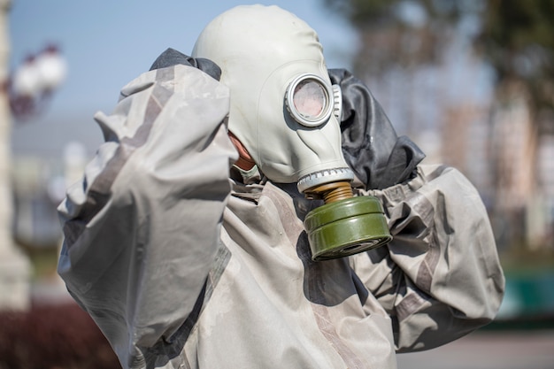 Military man disinfecting the surroundings