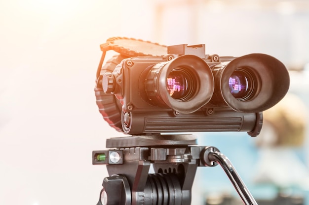 Military modern binoculars on a tripod infrared and night vision