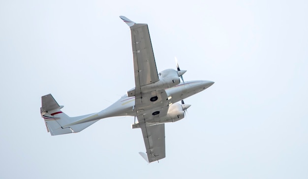 Military reconnaissance aircraft, twin-engine, single, on a background of sky. Close-up.