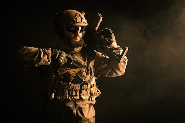 Military special forces in uniform with weapons attack at night elite troops