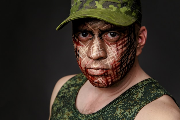 Military Style Camouflage on the Soldier's Face