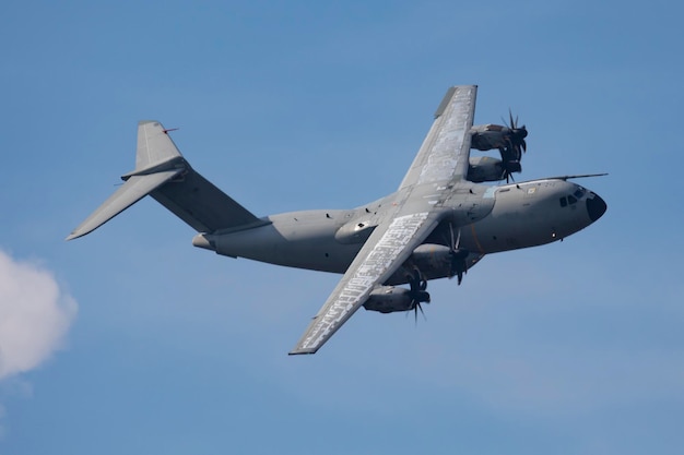 Photo military transport plane aircraft without title at airport aviation theme in flight flying