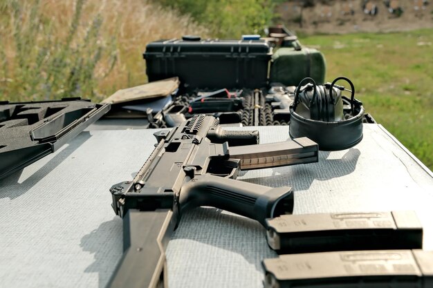 Military weapon lies on the table pistol weapons at the shooting range