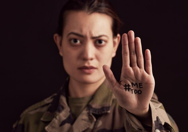 Military woman hand and hashtag me too against abuse or rape on black studio background Face portrait victim and army female from Ukraine standing against sexual abuse violence or harassment