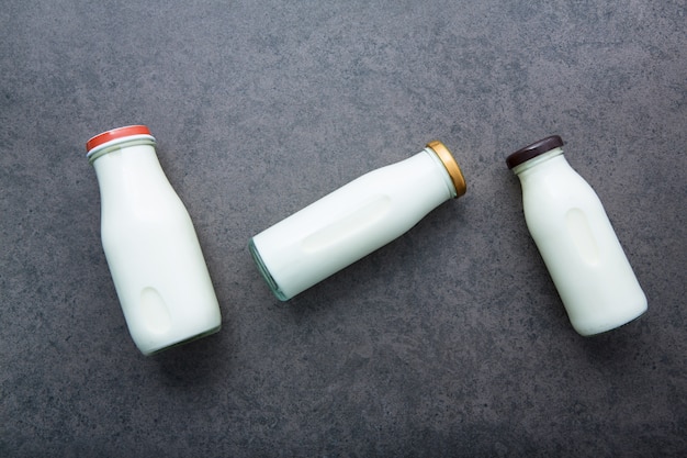 Milk bottle on dark stone background