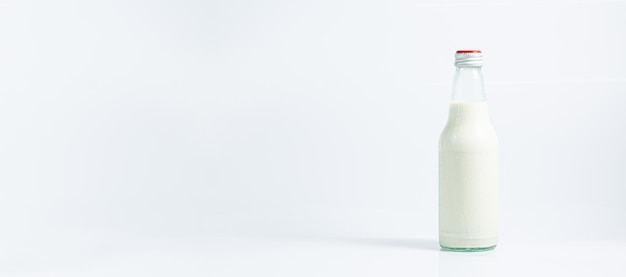 milk bottle on a white backgroundFresh milk in a glass bottle and empty isolated on white backgroun