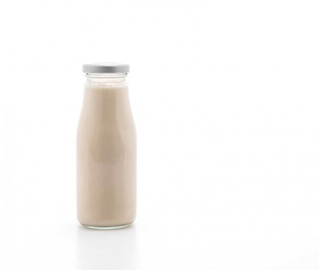 milk in bottle on white