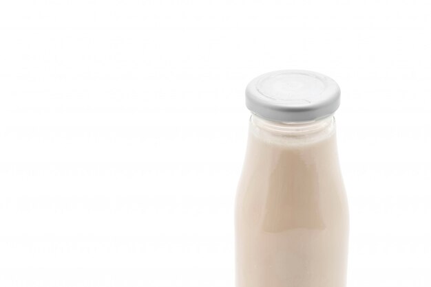 milk in bottle on white