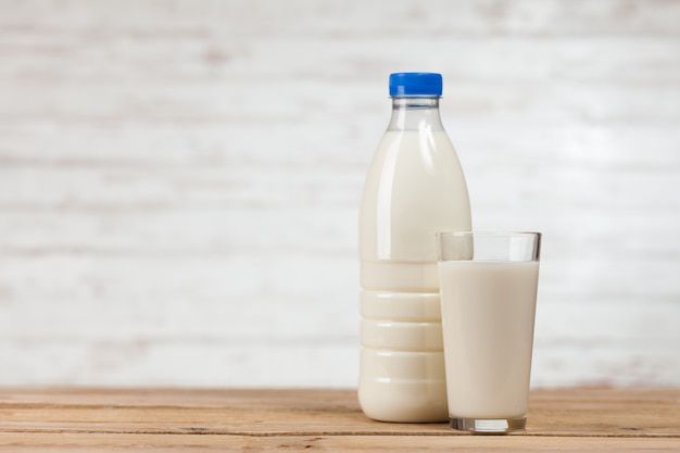 Milk bottle on wooden table